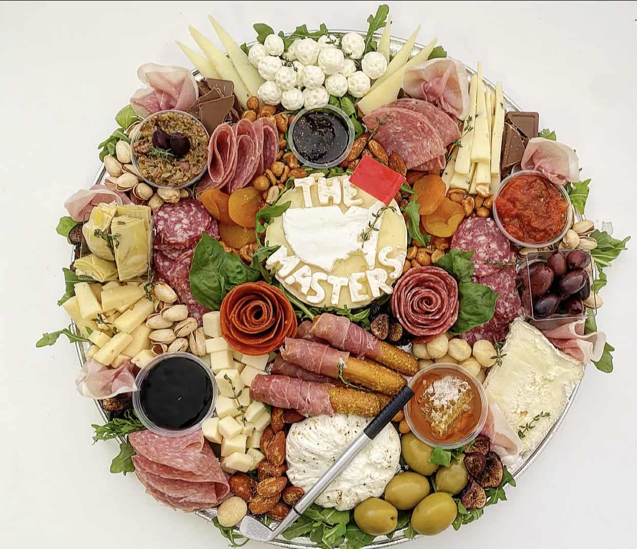 A charcuterie board themed for The Masters golf tournament.
