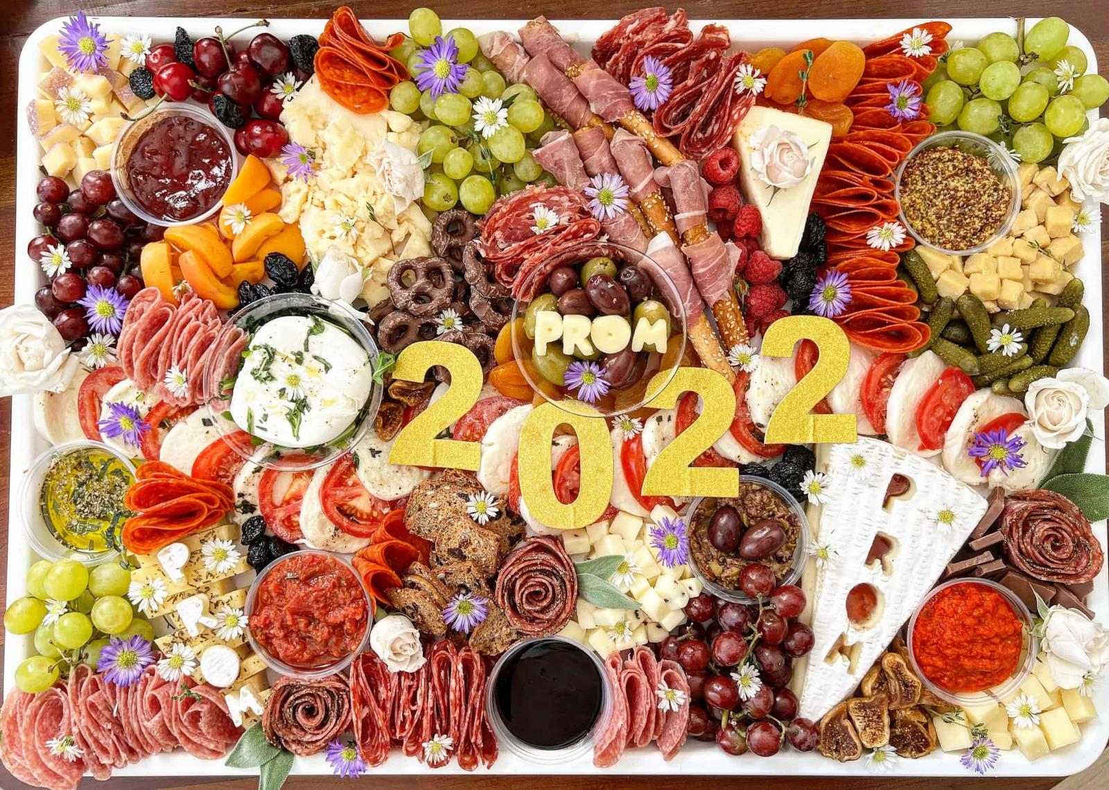 A large charcuterie board arranged for a prom night celebration.